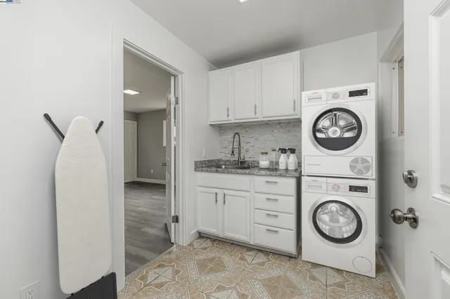 a view of cabinets a washer and dryer