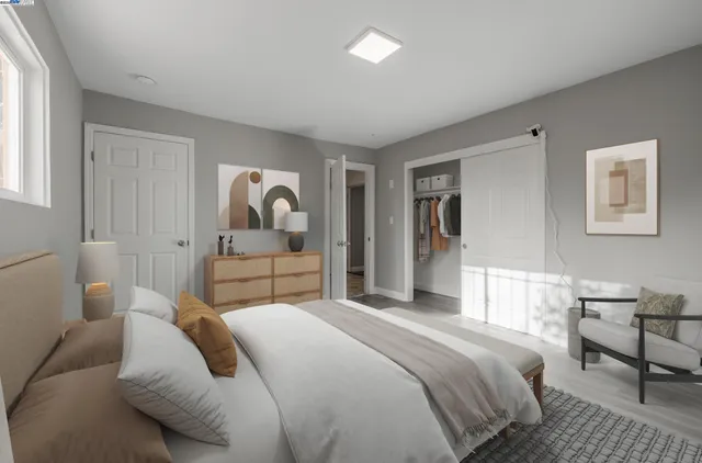 a bedroom with a bed and wooden floor