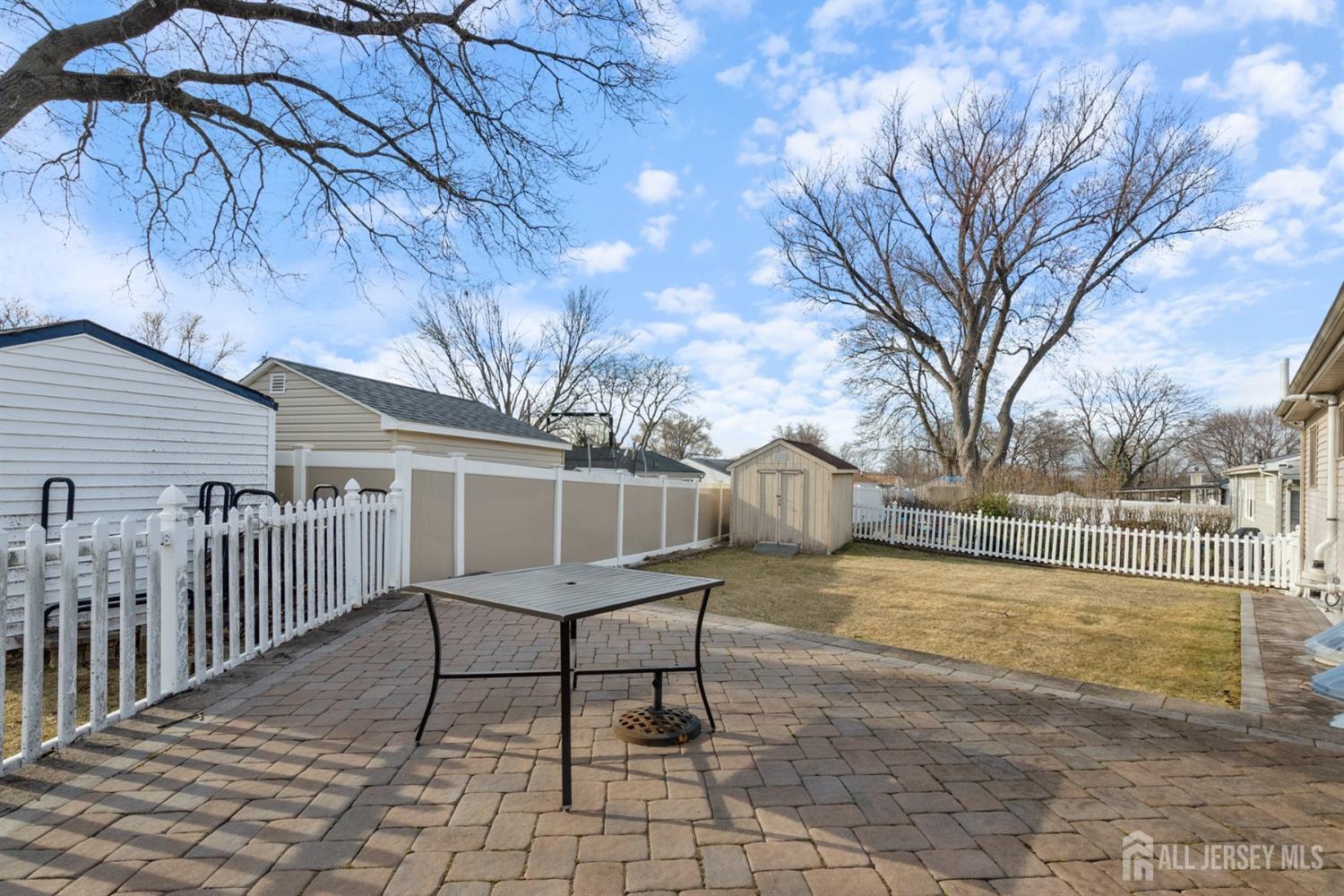 31 Villanova Road Old Bridge, NJ 08859 - Photo 27 of 29 a white bench sitting in front of house