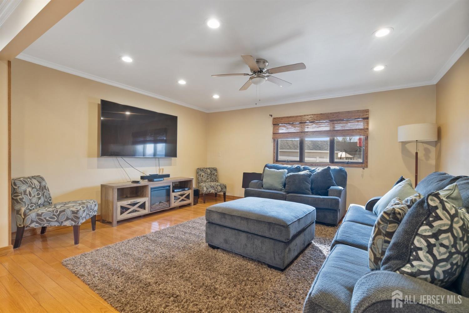 31 Villanova Road Old Bridge, NJ 08859 - Photo 6 of 29 a living room with furniture and a flat screen tv