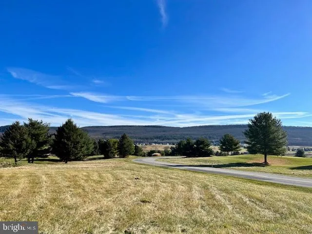 a view of building with yard