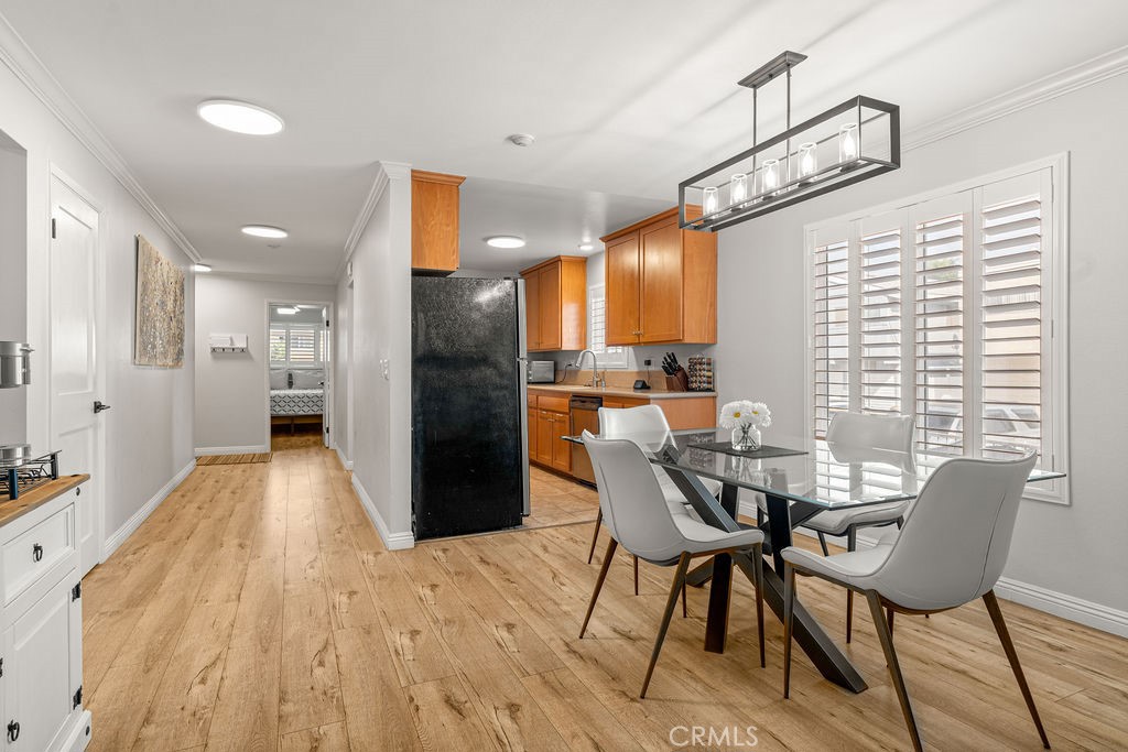 1321 Beryl Street, Unit 101 Redondo Beach, CA 90277 - Photo 12 of 40 a view of a dining room with furniture window and wooden floor