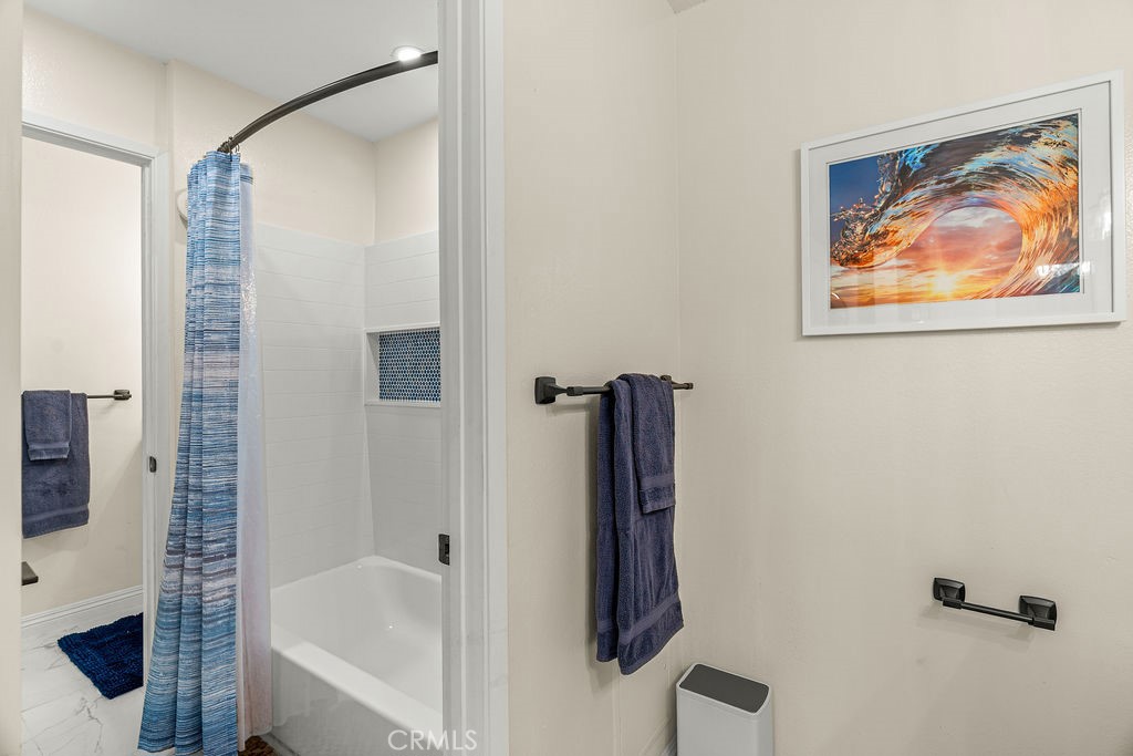1321 Beryl Street, Unit 101 Redondo Beach, CA 90277 - Photo 21 of 40 a bathroom with a bathtub and a shower