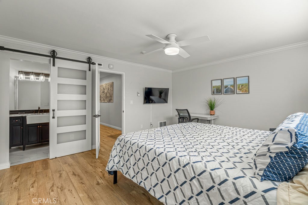 1321 Beryl Street, Unit 101 Redondo Beach, CA 90277 - Photo 6 of 40 a bedroom with a bed and a television