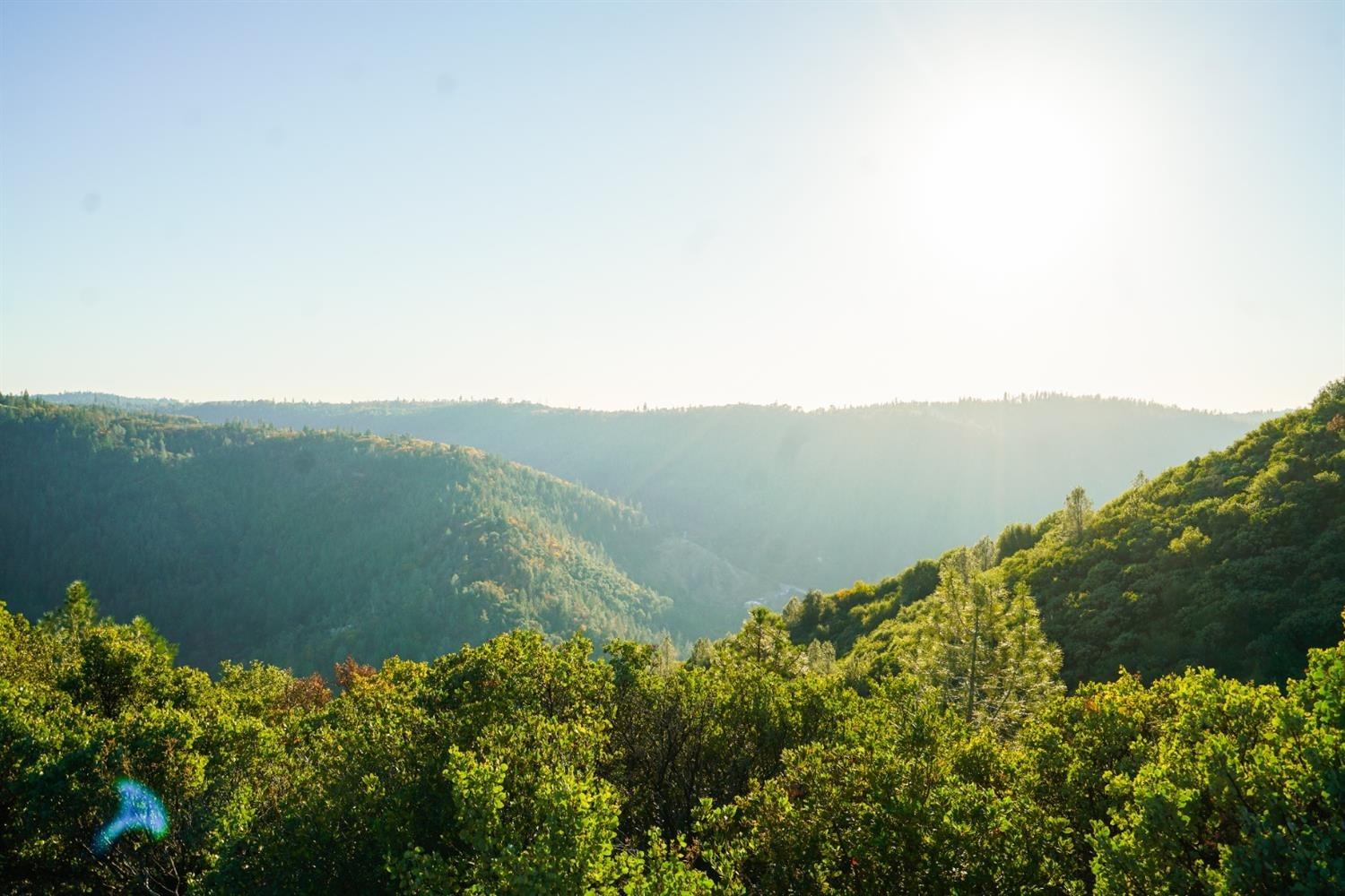 9220 Mule Skinner Road Placerville, CA 95667 - Photo 5 of 15 a view of a lake with a mountain in the background