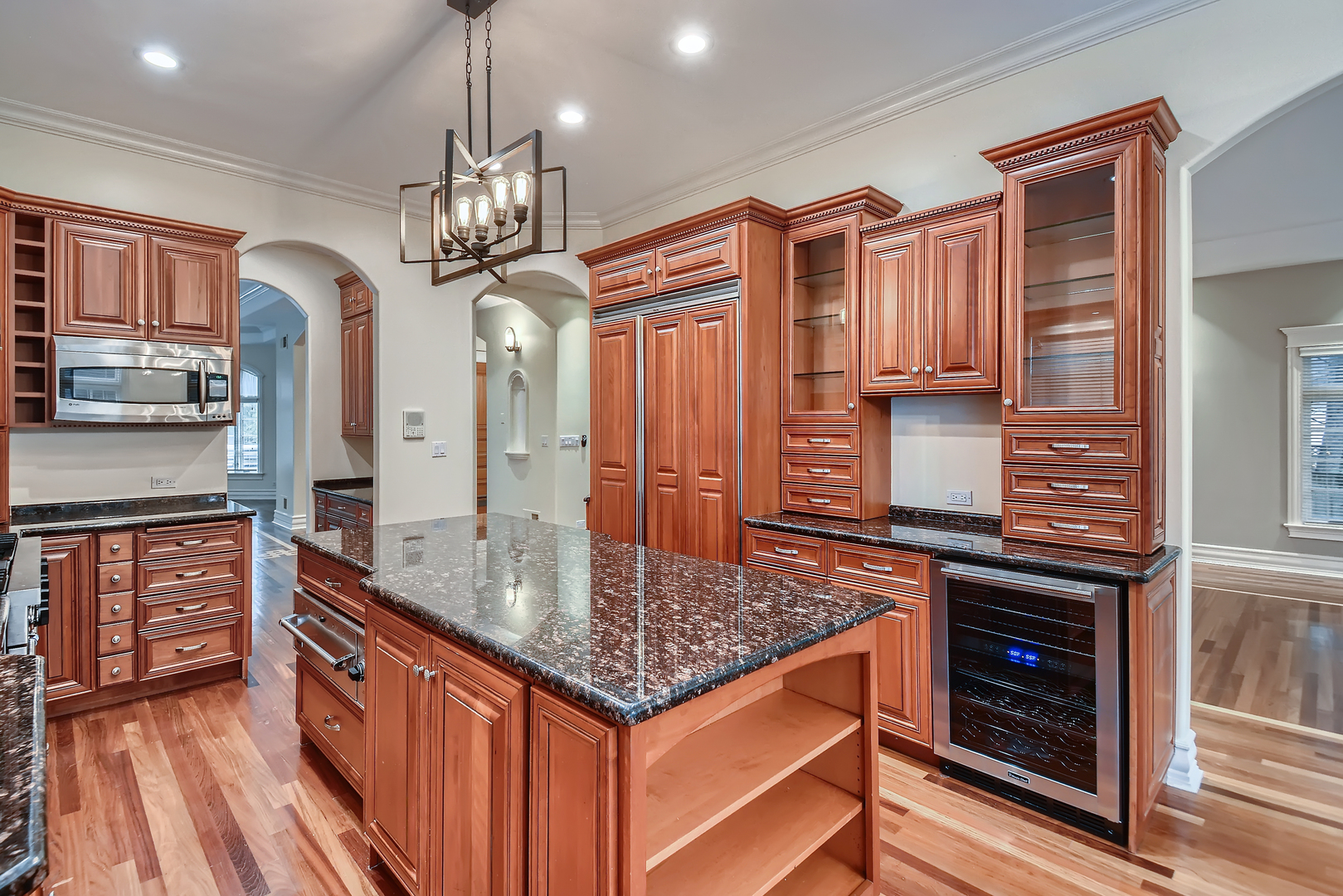 1011 Willow Road Winnetka, IL 60093 - Photo 8 of 37 a kitchen with stainless steel appliances granite countertop a kitchen island a stove and a sink