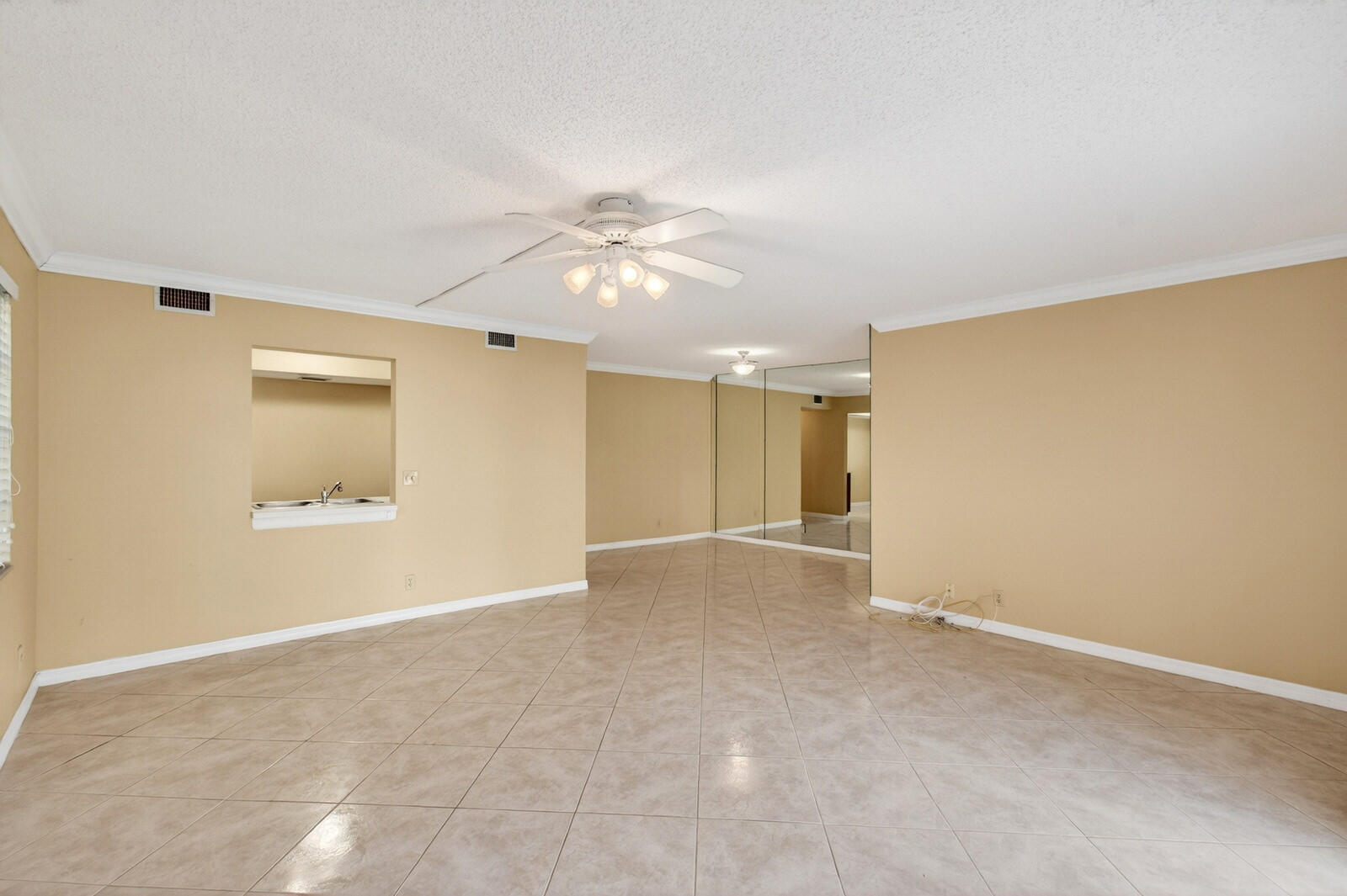 3951 Northeast 19th Road, Unit 1701 Pompano Beach, FL 33064 - Photo 28 of 82 an empty room with a ceiling fan and a window