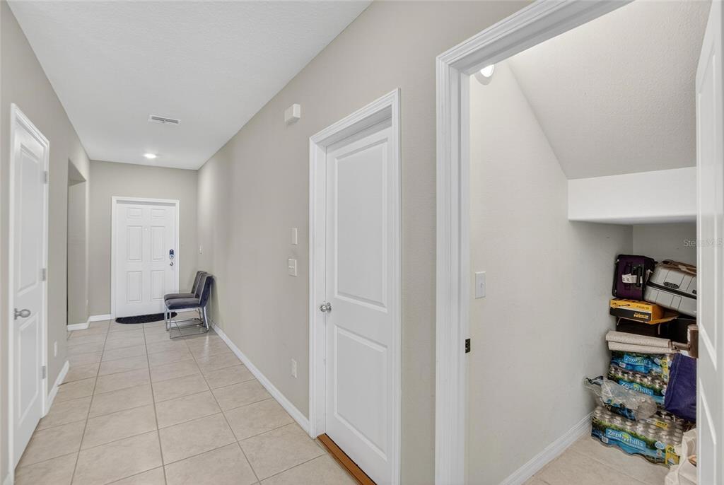31783 Sun Kettle Loop Wesley Chapel, FL 33545 - Photo 19 of 73 a view of a hallway with seating area