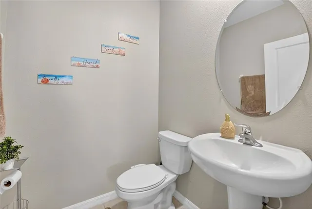 a bedroom with a bed and a ceiling fan in it