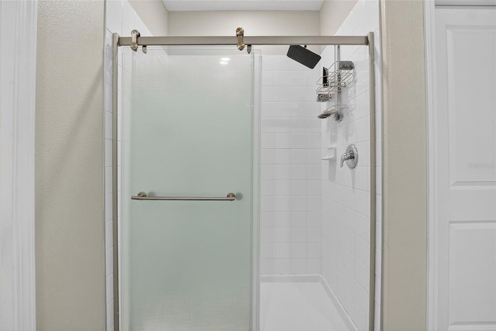 31783 Sun Kettle Loop Wesley Chapel, FL 33545 - Photo 28 of 73 a bathroom with a shower