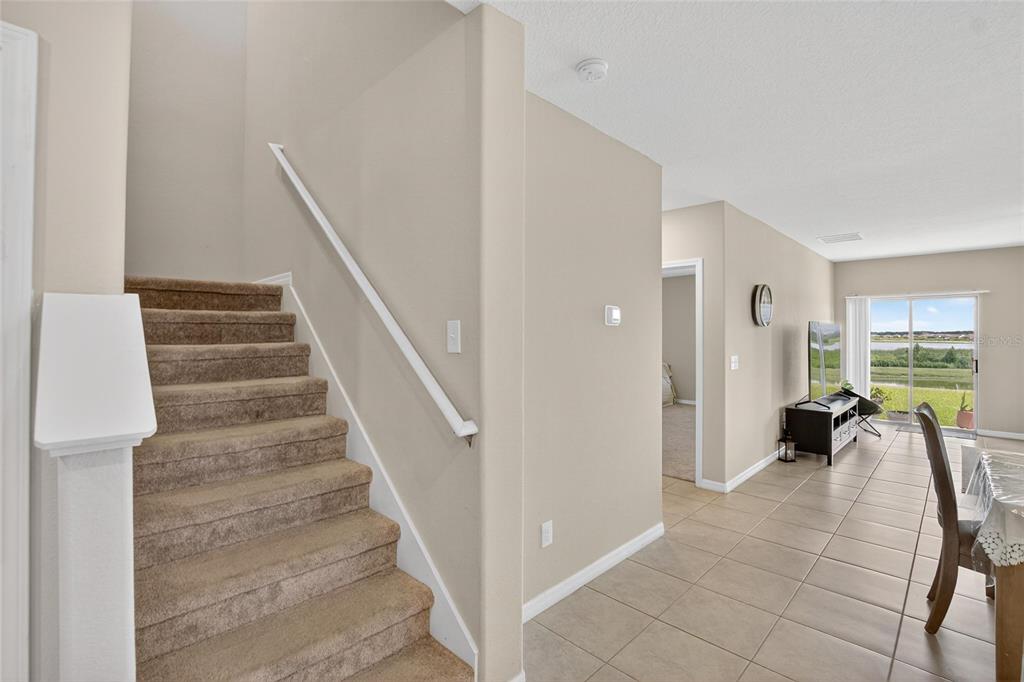 31783 Sun Kettle Loop Wesley Chapel, FL 33545 - Photo 32 of 73 a view of entryway and hall with wooden floor