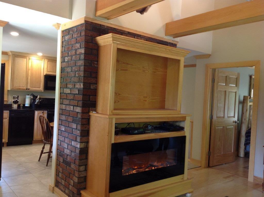 701 Hinckley Road Clinton, ME 04927 - Photo 8 of 20 Living room with electric fireplace.