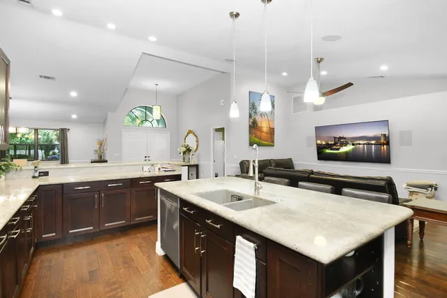 a spacious bathroom with a double vanity sink a mirror and a shower