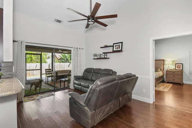 an aerial view of a house with a yard and garden