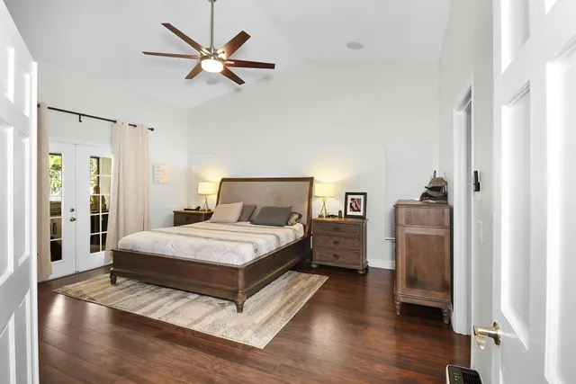 an aerial view of a house with a garden and swimming pool