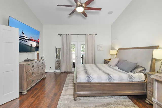 an aerial view of residential house with outdoor space and trees all around