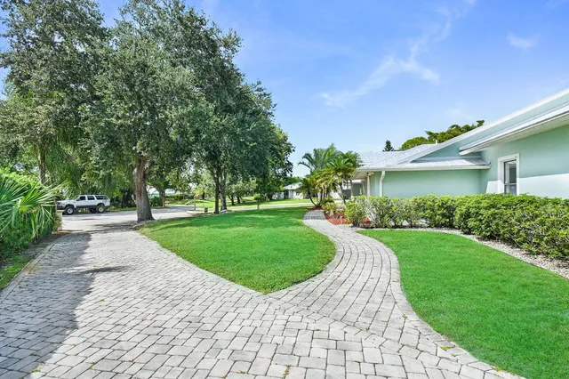 a kitchen with a table chairs stove and microwave