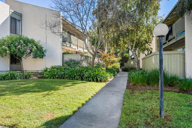 a view of house with swimming pool outdoor seating