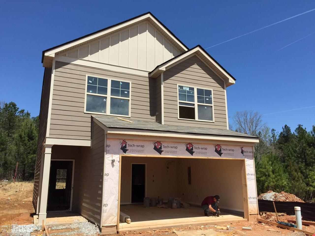 3160 Broadleaf Trail Road, Unit 5 Fairburn, GA 30213 - Photo 1 of 1 a front view of a house with a yard