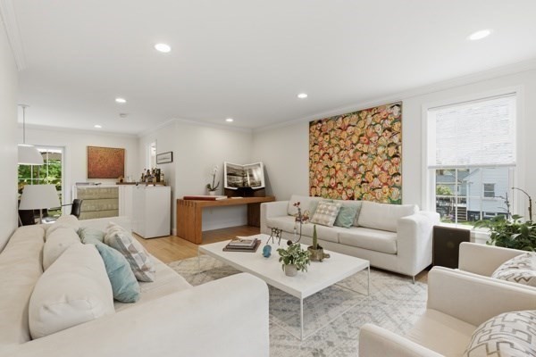 3 Wing Road Wilmington, MA 01887 - Photo 10 of 36 a living room with furniture kitchen view and a large window
