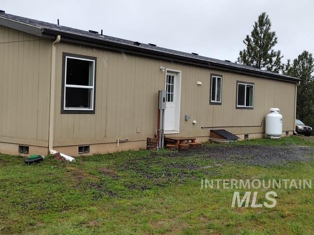 142 Shenandoah Third Street Kamiah, ID 83536 - Photo 4 of 50 Single-story exterior with vertical siding and multiple windows
