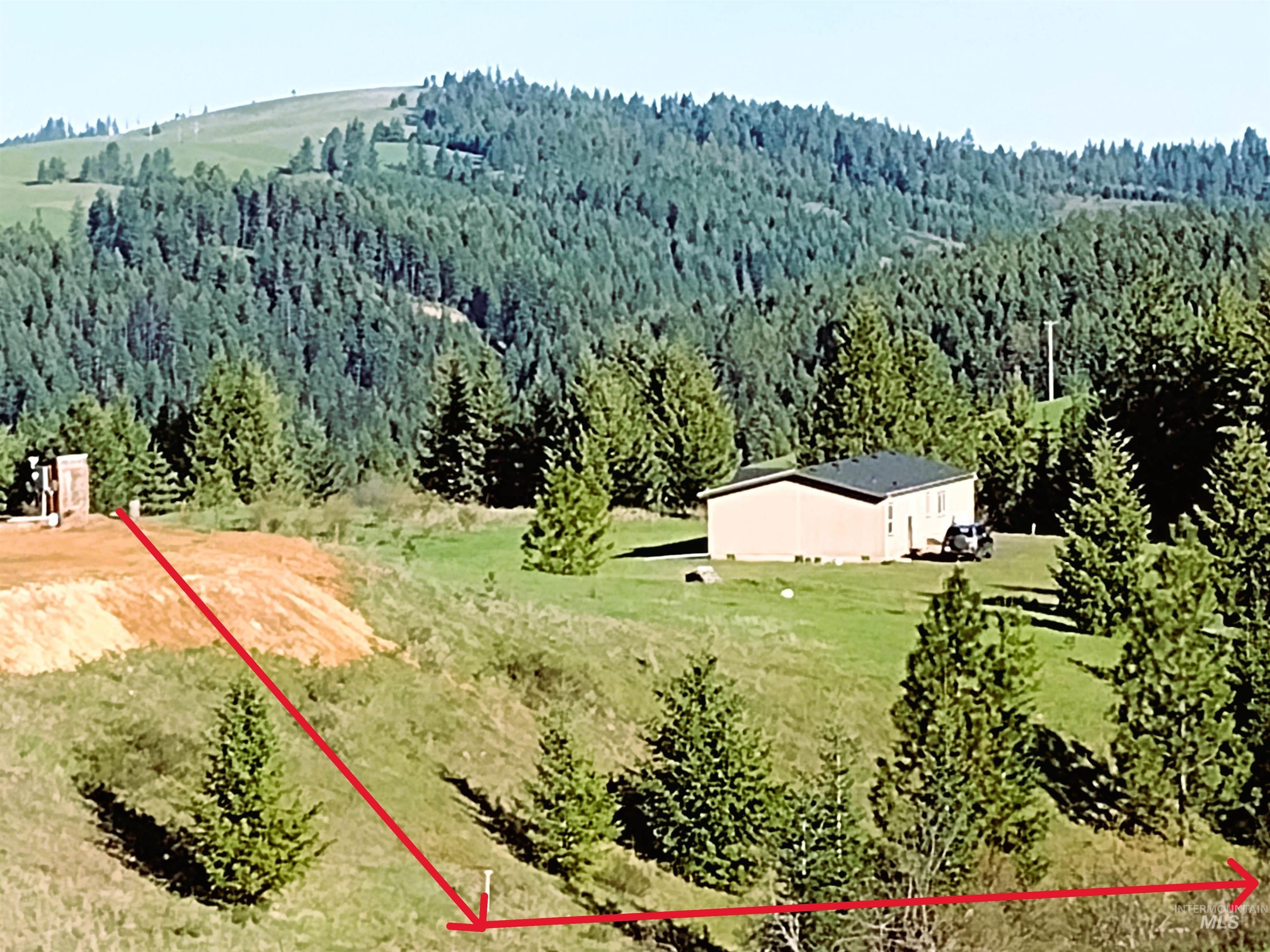 142 Shenandoah Third Street Kamiah, ID 83536 - Photo 5 of 50 Overview of rural landscape with a heavily wooded area and property parcel outlined