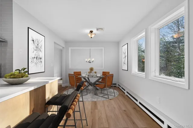 a view of a dining room with furniture window and outside view