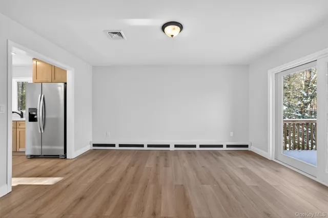 a view of a livingroom with wooden floor