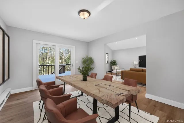 a view of a dining room with furniture window and wooden floor