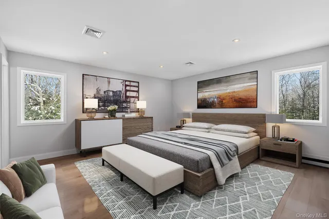 a bedroom with a large bed and a couch