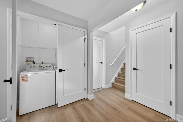 a view of a storage & utility room with wooden floor
