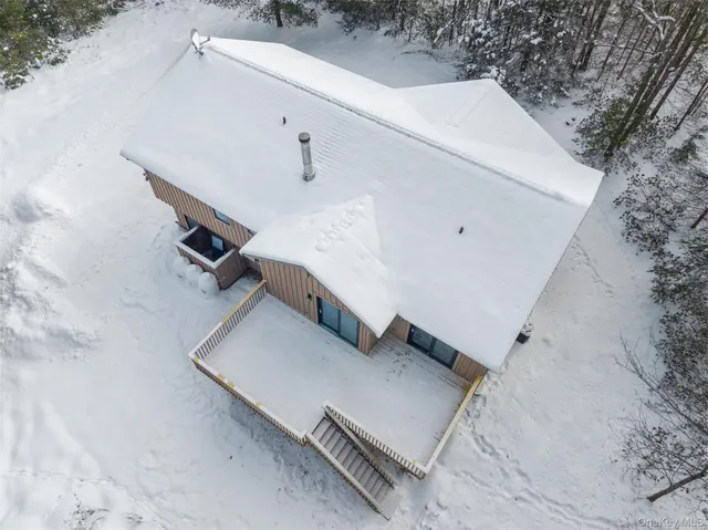 an aerial view of a house with pool