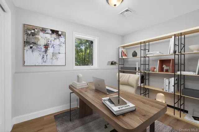 a living room with furniture a rug and a window
