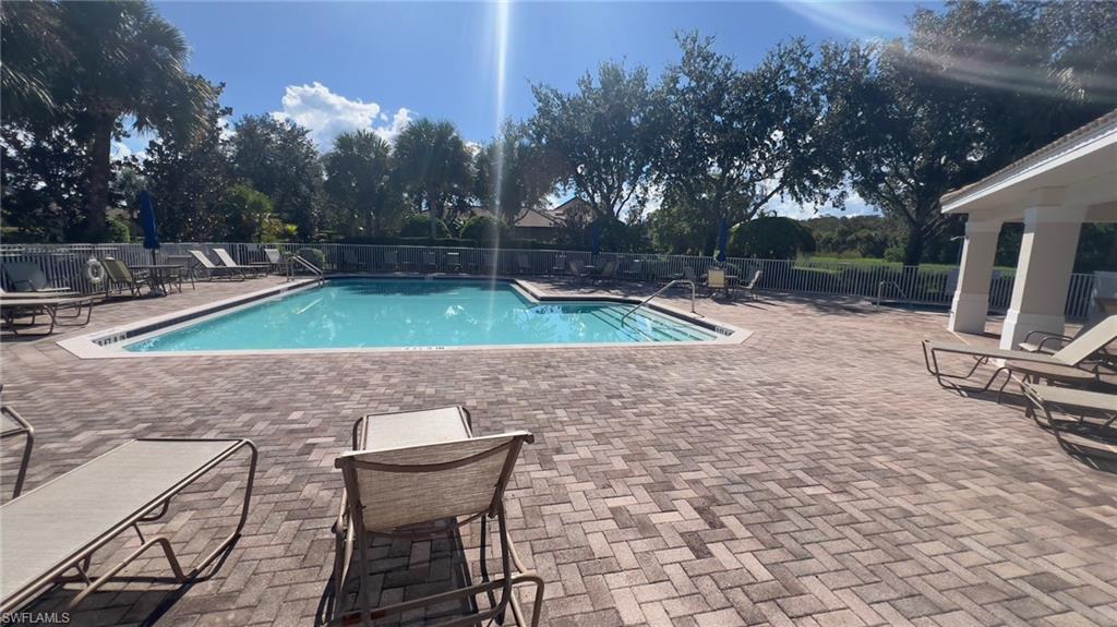 a view of a backyard with furniture and a slide