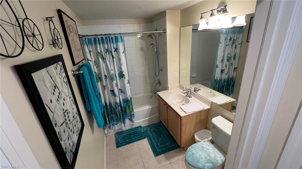 5705 Mayflower Way, Unit 1402 Ave Maria, FL 34142 - Photo 11 of 35 a bathroom with a sink a mirror and shower