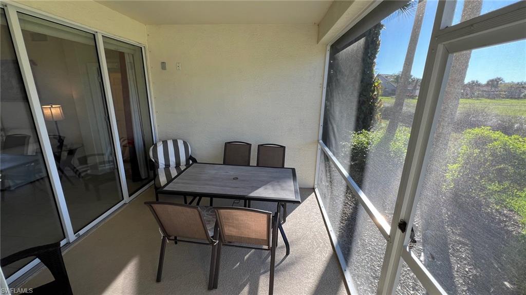 5705 Mayflower Way, Unit 1402 Ave Maria, FL 34142 - Photo 19 of 35 a view of a dining room with furniture window and wooden floor