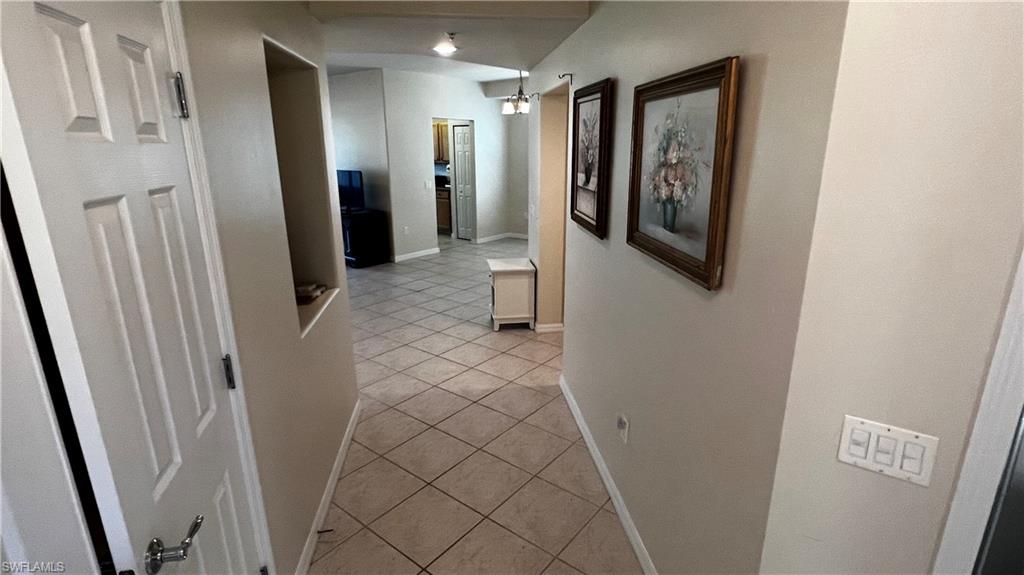 5705 Mayflower Way, Unit 1402 Ave Maria, FL 34142 - Photo 5 of 35 a bathroom with a shower and a mirror