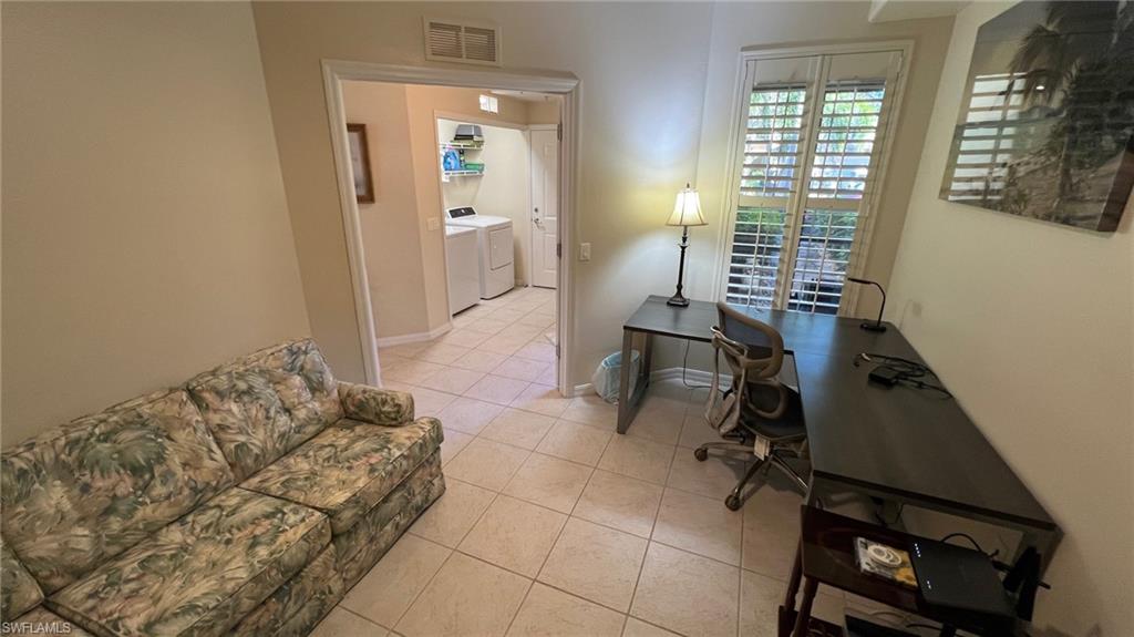 5705 Mayflower Way, Unit 1402 Ave Maria, FL 34142 - Photo 7 of 35 a bedroom with a bed and a window
