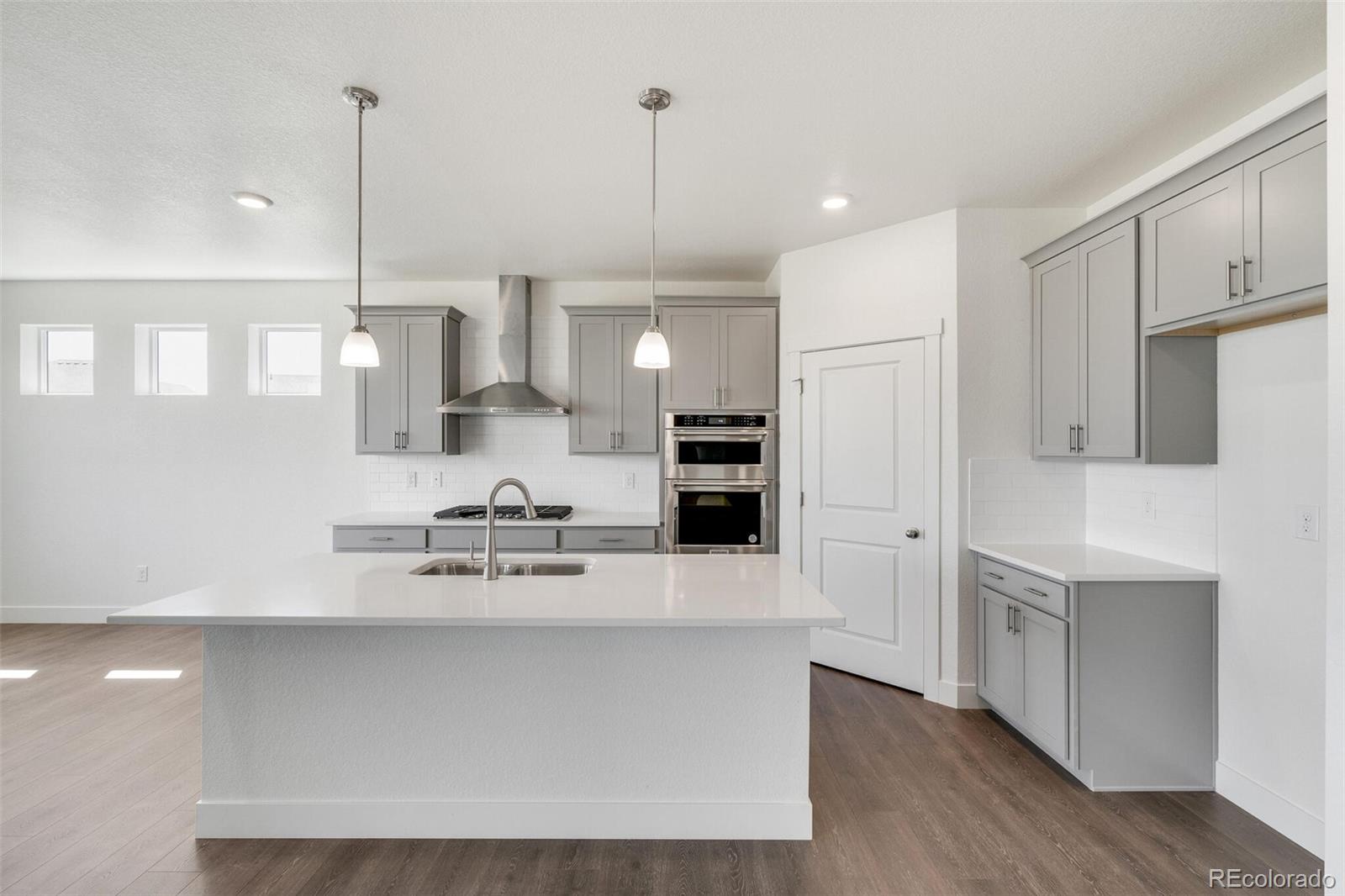 1105 Clara View Drive Berthoud, CO 80513 - Photo 13 of 35 a kitchen with stainless steel appliances a refrigerator sink and microwave
