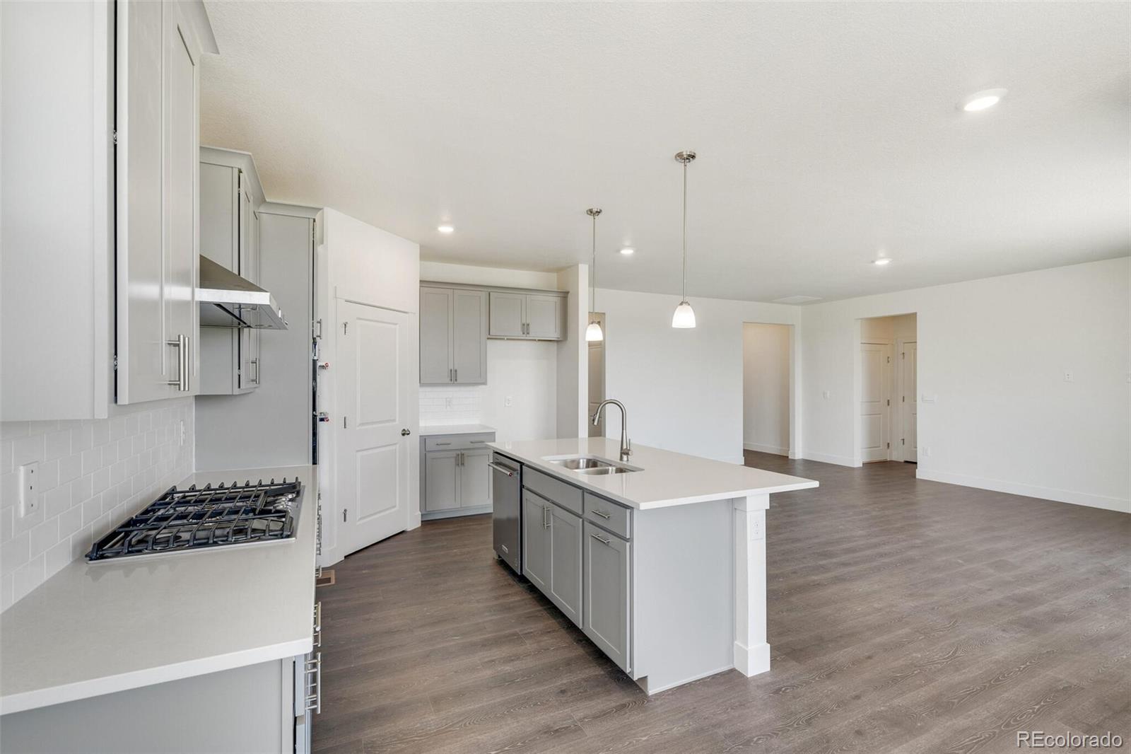 1105 Clara View Drive Berthoud, CO 80513 - Photo 15 of 35 a kitchen with cabinets and wooden floor