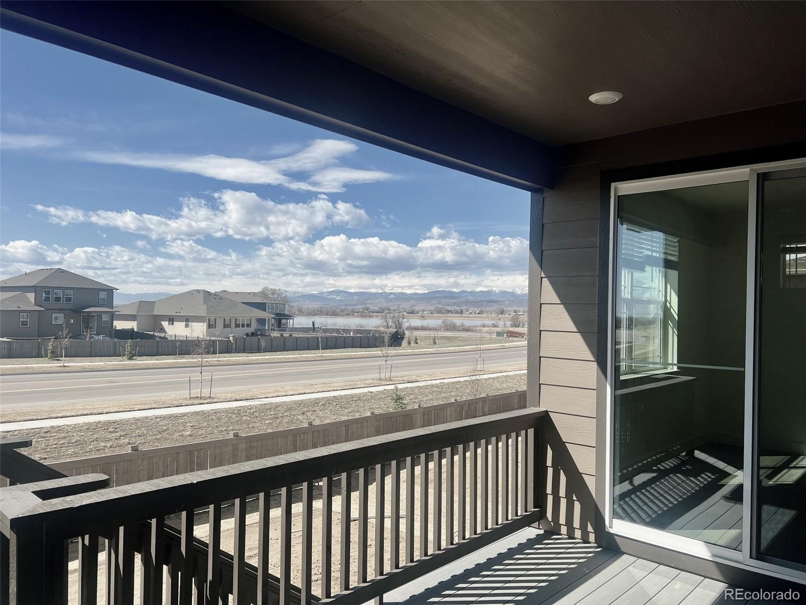 1105 Clara View Drive Berthoud, CO 80513 - Photo 28 of 35 a view of a balcony with wooden floor