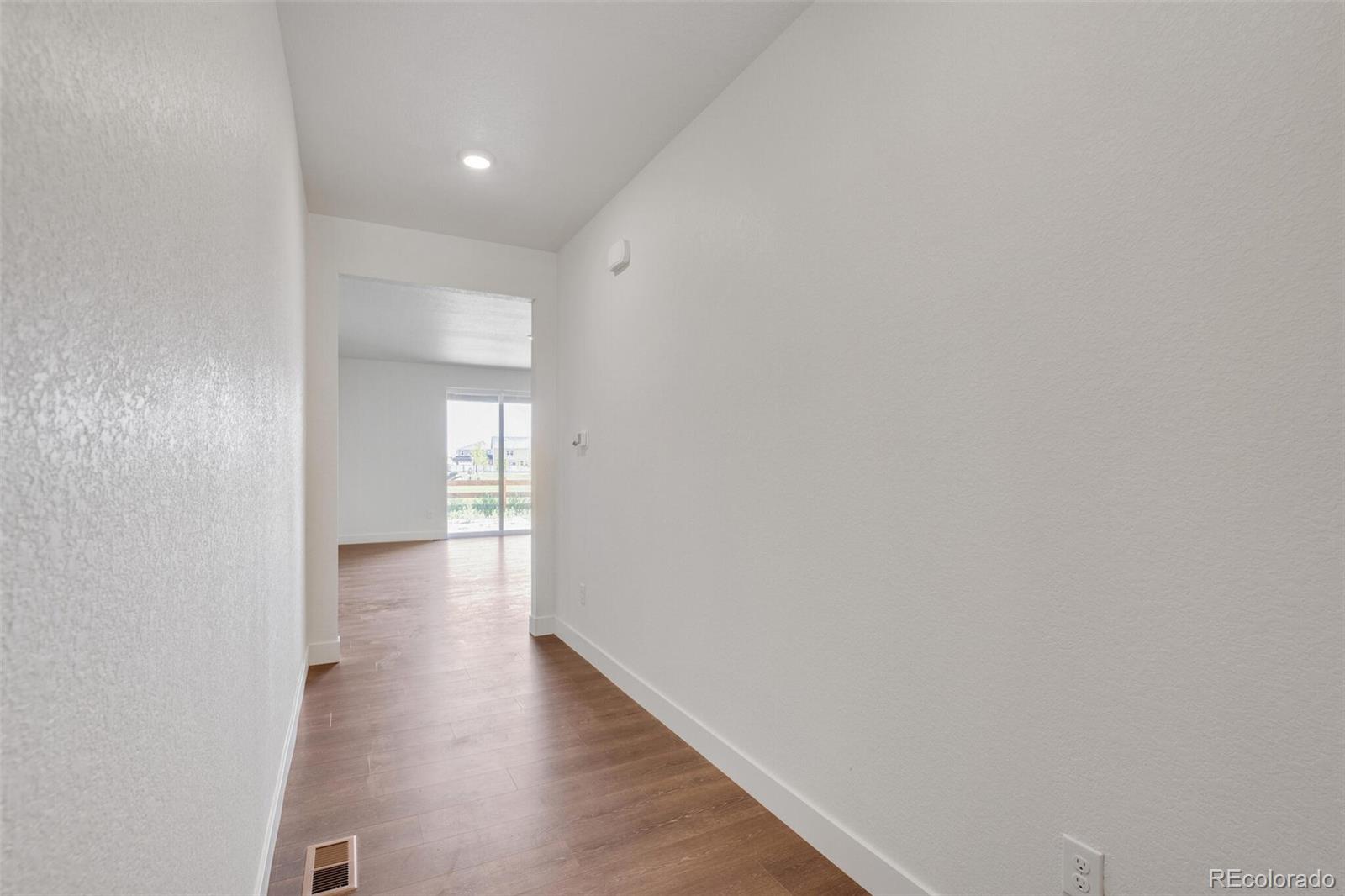 1105 Clara View Drive Berthoud, CO 80513 - Photo 4 of 35 a view of empty room with wooden floor