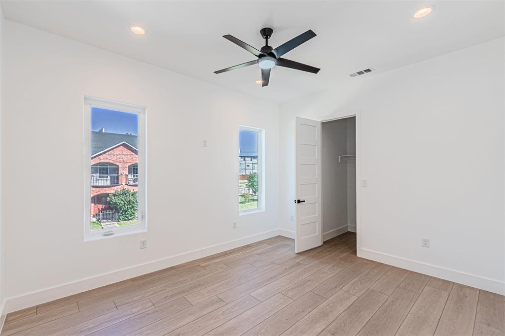 4309 Sylvester Street Dallas, TX 75219 - Photo 25 of 39 wooden floor in an empty room with a window