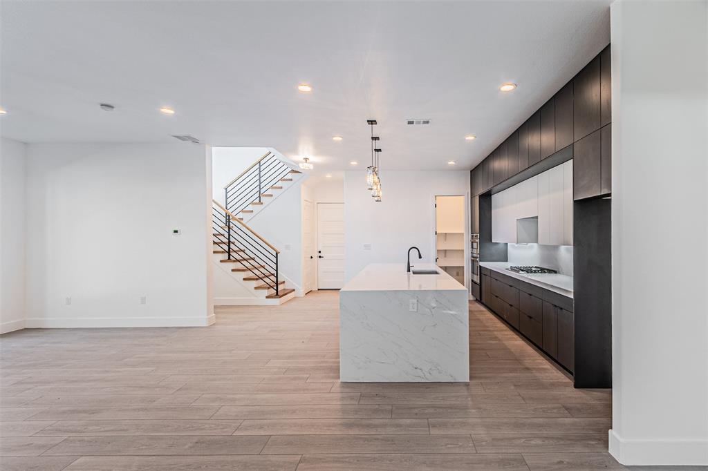 4309 Sylvester Street Dallas, TX 75219 - Photo 7 of 39 a living room with stainless steel appliances furniture and a kitchen view