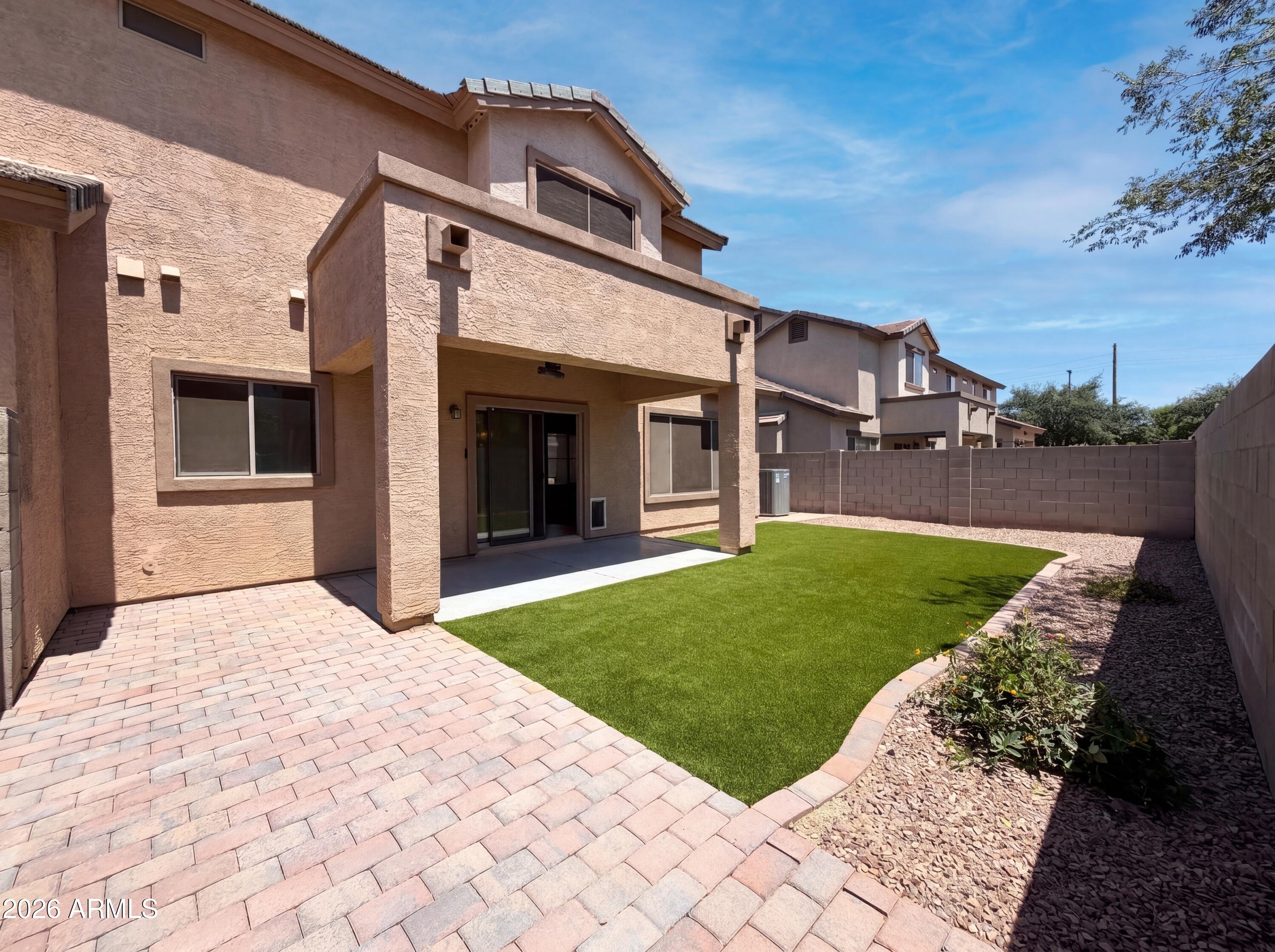 1565 East Hopkins Road Gilbert, AZ 85295 - Photo 25 of 29 a view of a house with a yard and garage
