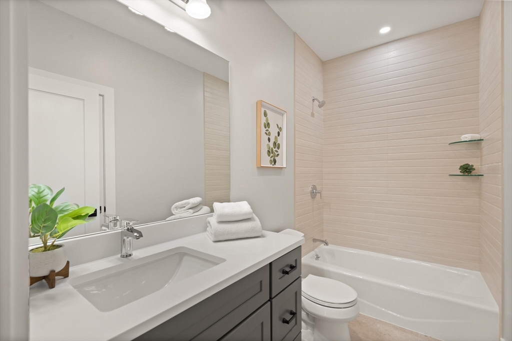 33 Barbara Road Newton, MA 02465 - Photo 18 of 42 a bathroom with a sink toilet and shower