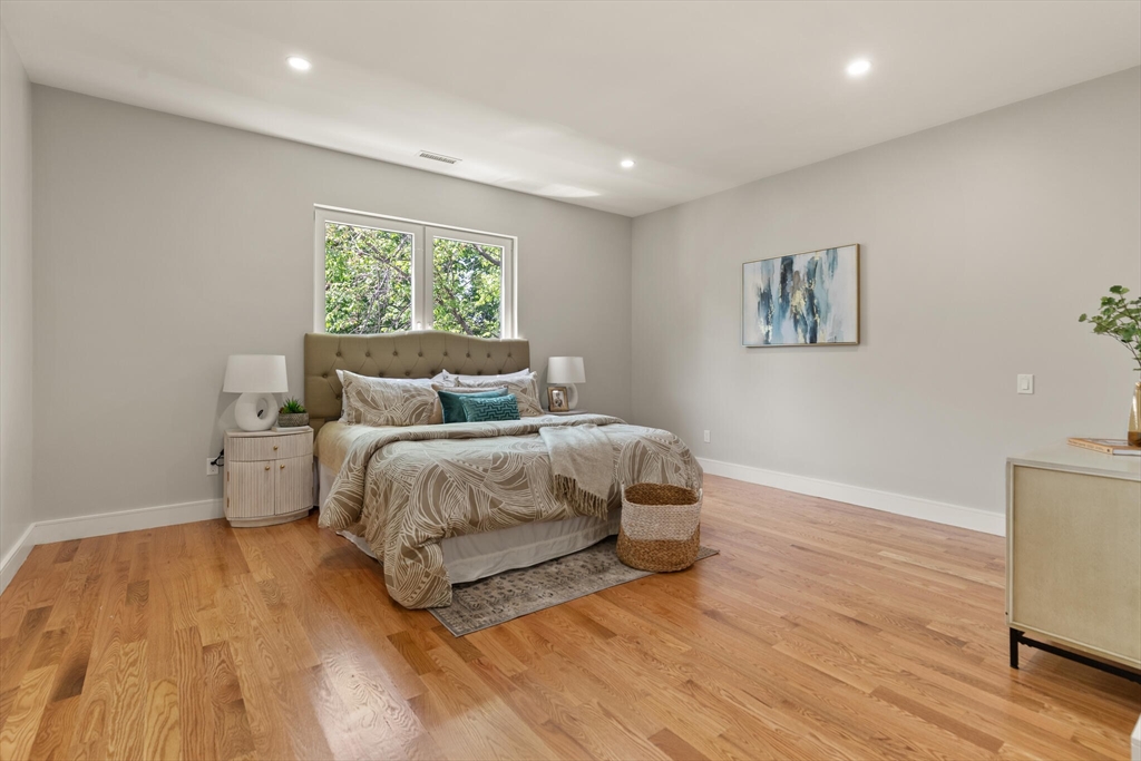 33 Barbara Road Newton, MA 02465 - Photo 21 of 42 a bedroom with a bed and a painting on the wall