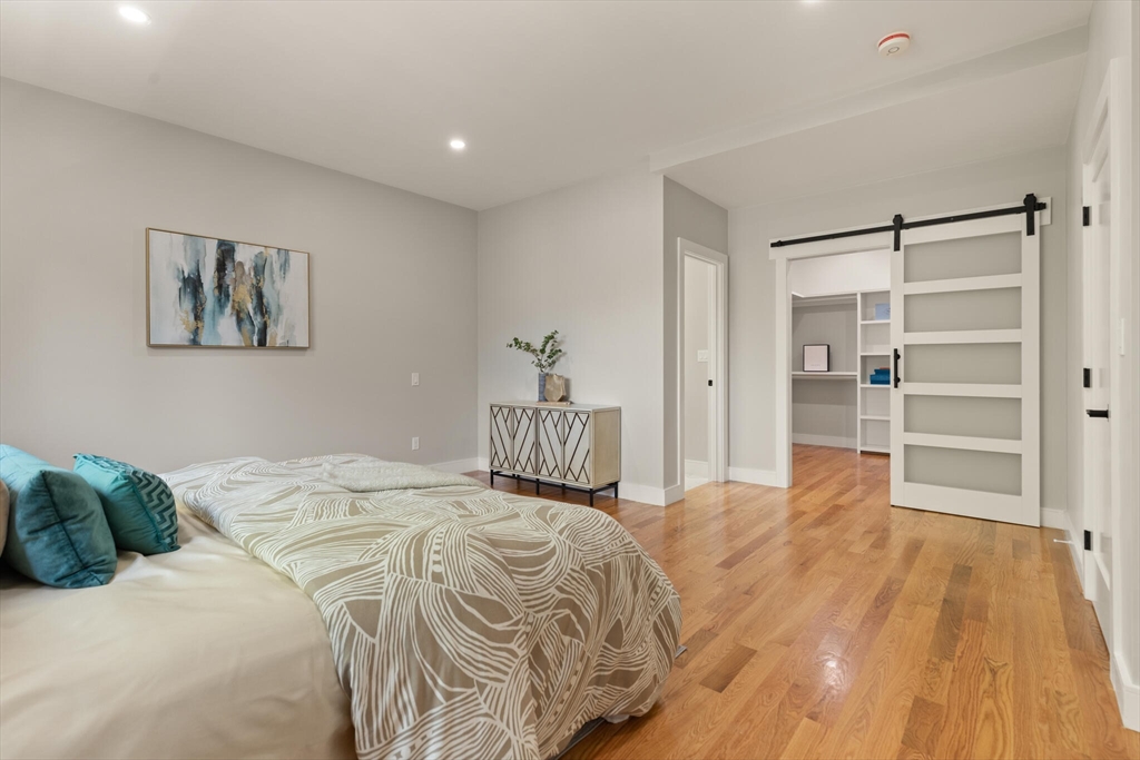 33 Barbara Road Newton, MA 02465 - Photo 22 of 42 a bedroom with a bed and a flat screen tv