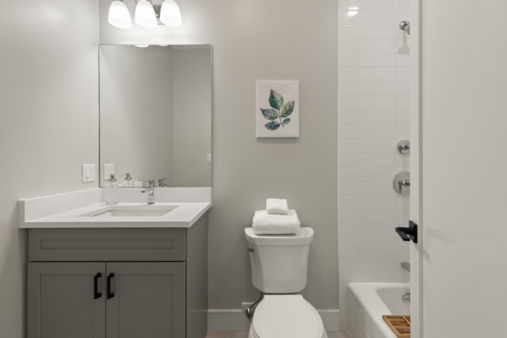 33 Barbara Road Newton, MA 02465 - Photo 29 of 42 a bathroom with a toilet a sink and mirror