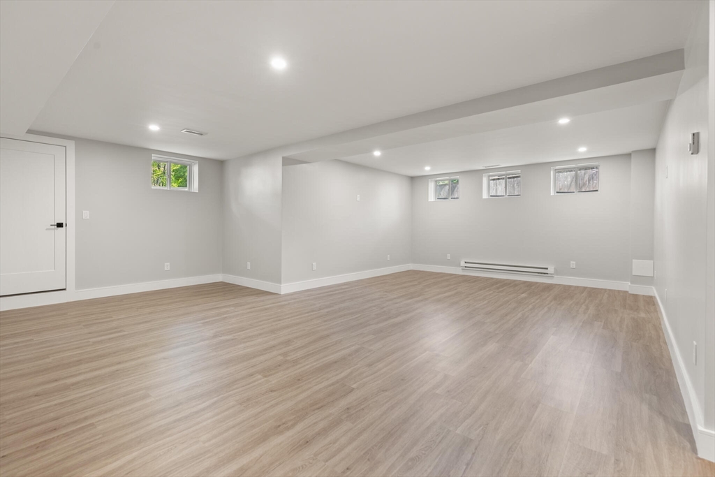 33 Barbara Road Newton, MA 02465 - Photo 31 of 42 an empty room with wooden floor and windows